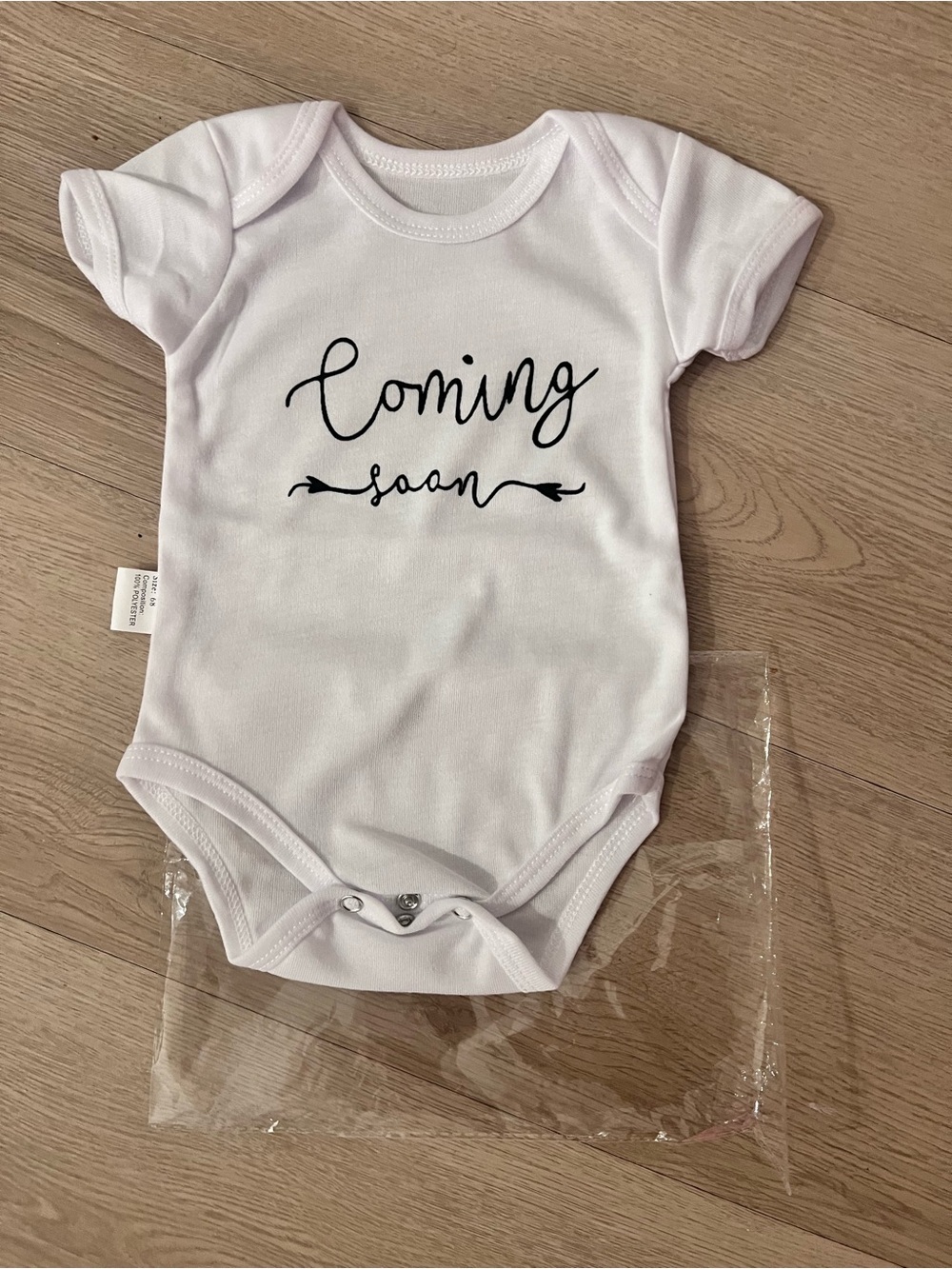 White "Coming Soon" Baby Onesie